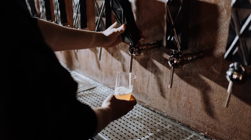Man tapping beer from a tap