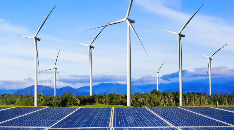 A vibrant and sustainable farm landscape featuring solar panels, wind turbines, under a clear blue sky.
