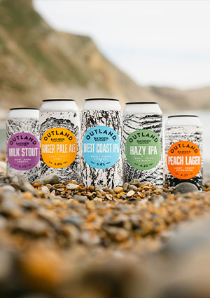 six Outland cans by Hall & Woodhouse