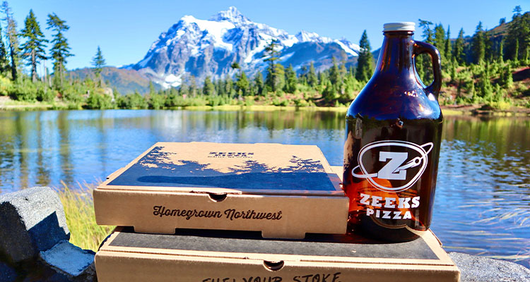2 Zeeks pizza boxes & a bottle of Zeeks Pizza drink